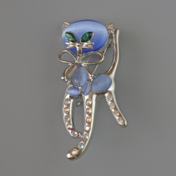 Kitty brooch pendant with blue cat's eye, green crystals, pink and white rhinestones, silver-colored metal 25×55 mm