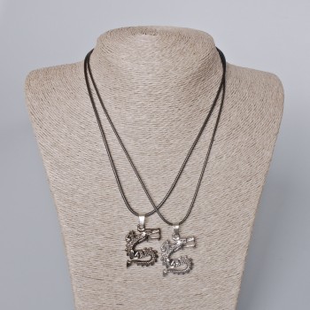 Paired pendants 'Dragon' black enamel and silver metal 33x26mm, length 45-50 cm