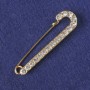 Brooch-pin with white crystals, golden metal 72x20mm+