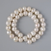 Textured freshwater pearls, diameter 9.5 × 8.5 mm, length 35 cm on a thread