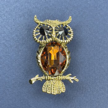 Owl Brooch-Pendant with brown and black crystals, golden metal, diameter 26 mm ±, length 44 mm ±
