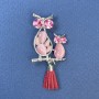 Brooch pendant 'Owl' with pink cat's-eye gemstone, pink crystals, silver-toned metal, diameter 24 mm ±, length 50 mm ±