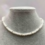 Choker with natural mother-of-pearl rondelle beads 5x3 mm +/- with metal inserts and white rhinestones, length 35-43 cm +/-