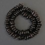 Garnet Beads, Faceted, 10–12×5–6 mm, on a beading thread