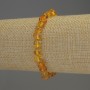 Amber bracelet with faceted 7x5 mm beads and 2 mm seed beads, length 18 cm, stretch