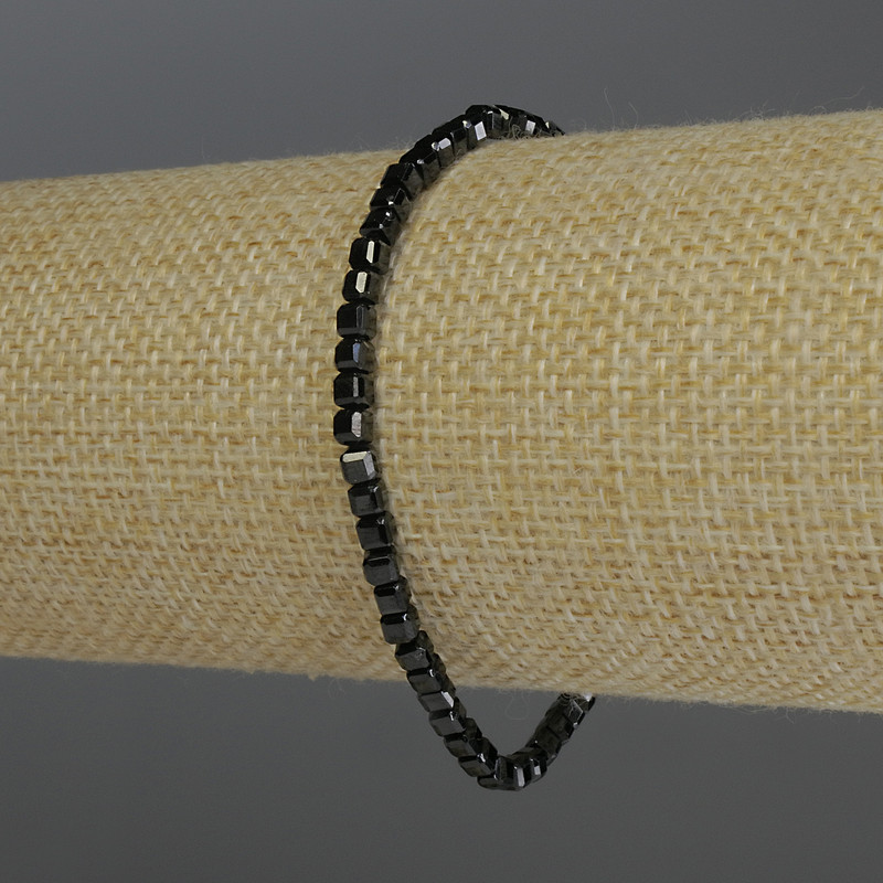 Bracelet with black tourmaline, faceted cube beads, 3 mm diameter, 18 cm stretch