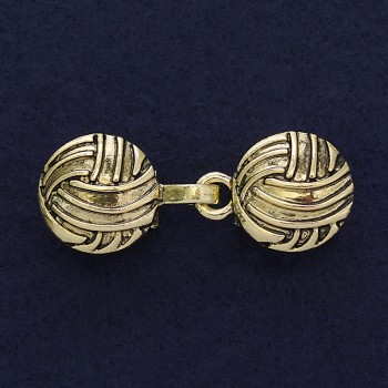 Gold-tone cardigan brooch clasp, approximately 20 mm in diameter and 52 mm long