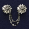 Silver-tone cardigan brooch, 21 mm diameter ±, chain length 9 cm ±