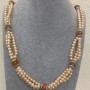 Three-row necklace with freshwater pearls and carnelian ball, diameter 5-6×5-4 mm; carnelian ball 10 mm; adjustable length, 53 cm + 5 cm; extension chain
