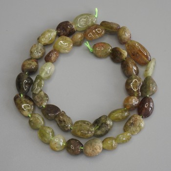 Grossular beads, faceted, diameter 9-12×9 mm ±, length 40 m ± on thread