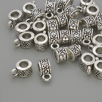 Bail findings, silver-colored metal, dimensions 6×5×10 mm ±, holes 4 mm and 2 mm diameter ±, packaging 20 g (~30 pcs)