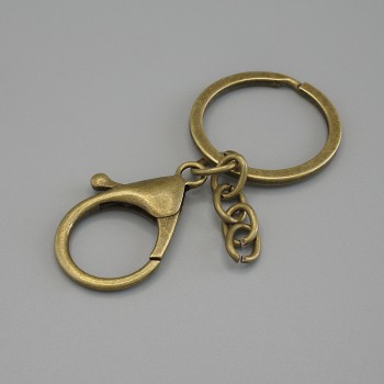 Price per pack /10 pcs. Base for keychain with two attachments: carabiner 33×24 mm and ring, diameter 3 cm, length 7 cm