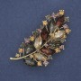 Twig Brooch with colored rhinestones in golden metal 71×35mm+