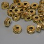 Gold-colored metal bead insert, diameter 7×4 mm, hole diameter ~2.9 mm, packaging 20 g (~25 pcs)