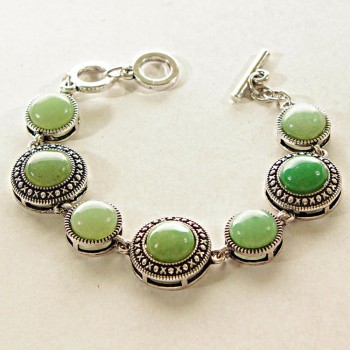 Clearance. Jade bracelet in bezel 'Dot Cross' with round stones, larger and smaller, 7 stones, 19 and 15 mm, length 18-21 cm