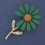 Brooch 'Daisy' with green enamel, white crystals, gold-tone metal, 65 x 39 mm