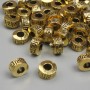 Gold-tone bead inserts, 6.5×4 mm, hole diameter 2.8 mm, packaged in 20 g (~37 pcs)
