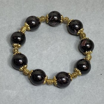 Garnet bracelet with smooth round beads 13 mm, metal inserts, length 18 cm ± stretch