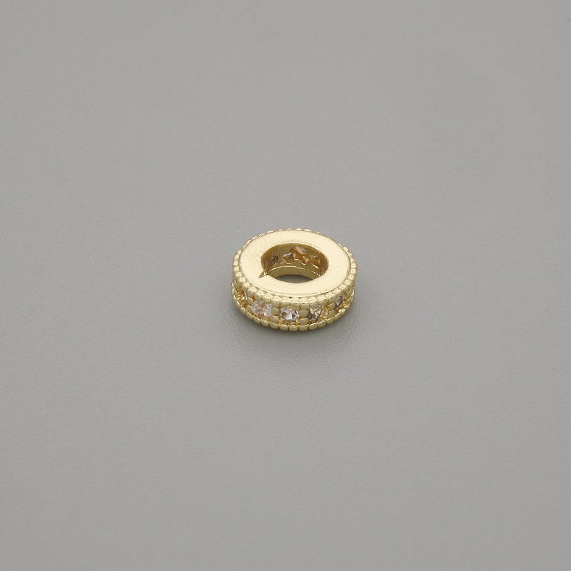 Gold-tone bead insert, 5.5 x 2 mm, hole diameter 3.5 mm, ± per piece