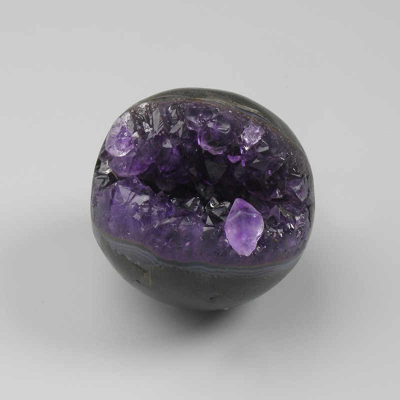Amethyst natural stone sphere with geode, diameter 40–50 mm ± assorted sizes, weight from 100 g. (Price per 100 g)