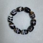Agate barrel-shaped bracelet 19x15 mm ± with metal inserts, length 18 cm ± stretch