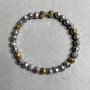 Bracelet with hematite, faceted 6 mm beads, dumbbell-shaped element 15×6 mm, length 18 cm, stretch