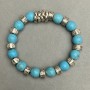 Elastic turquoise bracelet, diameter 10 mm (±) with metal inserts, length 18 cm +