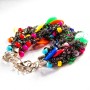 Bracelet with metal clasp and carabiner on a chain, macrame thread, black glossy faceted stones and multicolored round stones