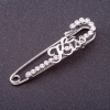 Kiss brooch-pin with white crystals, silver color, 5.5 x 1.5 cm