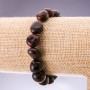 Elastic bracelet with natural Bull's Eye stone, cabochon-cut, 8×10 mm diameter+