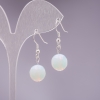 Moonstone earrings with a faceted bead, 10 mm diameter, hook clasp