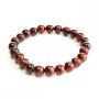 Elastic bracelet of natural Bull's Eye stone with a smooth bead, diameter 8(±)mm