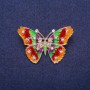 Brooch 'Butterfly' with red and green enamel on yellow metal