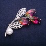 Brooch 'Twig' with a bead and yellow-pink crystals in Swarovski style, silver-tone metal 35x60 mm
