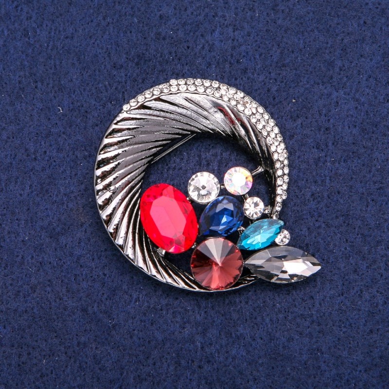 Round brooch with rhinestones, woven into a beautiful composition, dark metal, 45x50 mm