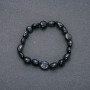 Bracelet made of natural Falcon's Eye stone on elastic with hammered texture, bead size 10x12 mm (±), circumference 18 cm