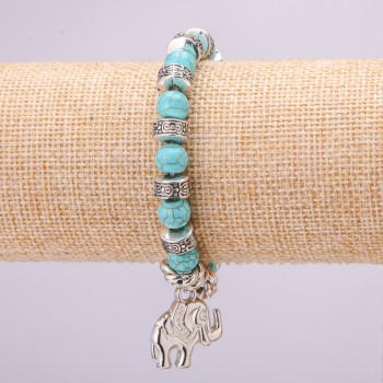 Turquoise bracelet on elastic cord, diameter ~8 mm (synthetic), length 18 cm with inserts and an elephant pendant