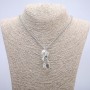 Pendant 'Bird with a Globe' 47x18 mm on a chain, length 70 cm, silver metal