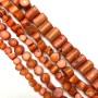 Beads of natural orange coral, faceted, diameter 12×10 mm, length 39 mm ± (price per 100 g).