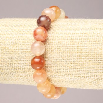 Elastic bracelet made of natural orange agate. Smooth bead, diameter 10.5 mm+