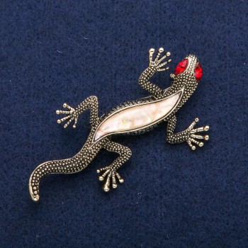 Brooch 'Lizard' with mother-of-pearl and red crystals, golden metal 34x67mm