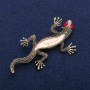 Brooch 'Lizard' with mother-of-pearl and red crystals, golden metal 34x67mm
