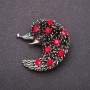 Brooch with red crystals 42x42 mm yellow metal