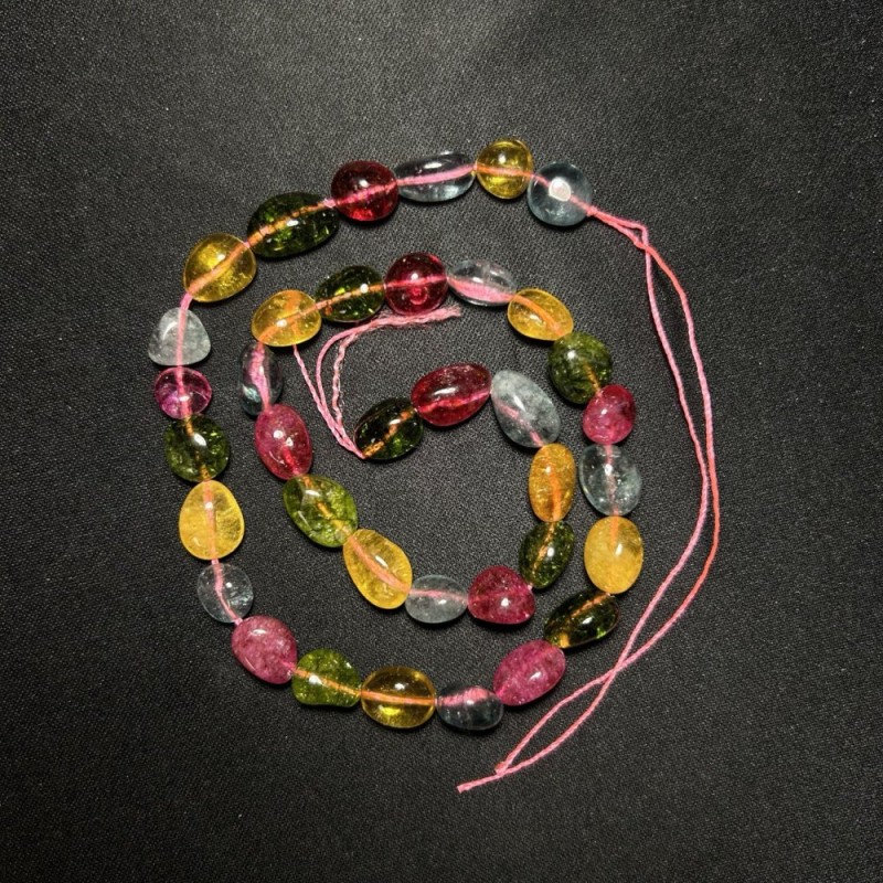 Tinted glass beads assortment, faceted, diameter 12x8mm, length 40 cm on thread