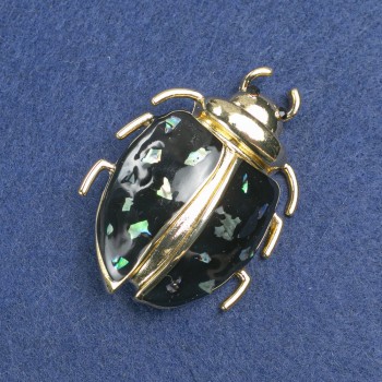 Brooch 'Bug' with golden metal, black enamel, abalone and black rhinestones, 58x24 mm +