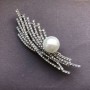 Silver-toned metal brooch-pendant with crystals and a bead, diameter 13mm ± 76x23mm