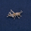 Grasshopper Brooch, silver-toned metal with black and yellow rhinestones 42x26 mm +