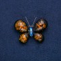 Butterfly Brooch in gold-tone metal with blue rhinestone and artificial dark amber, 50x35 mm +