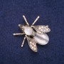 Butterfly Brooch with White Cat's Eye and Crystals 33×34 mm, gold-toned metal