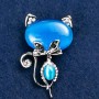 Brooch 'Kitty Cat's Eye' blue with white crystals 45×28 mm silver-tone metal